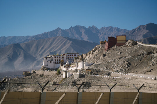 the Spituk Monastery near Leh India with a mountain and blue sky background 