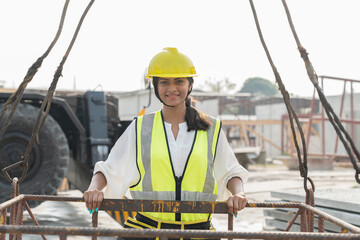 Foreman builder woman at construction site. Asian foreman construction woman working at construction site