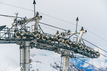 Metal support of the cable car in the mountains. Lift at the ski resort.