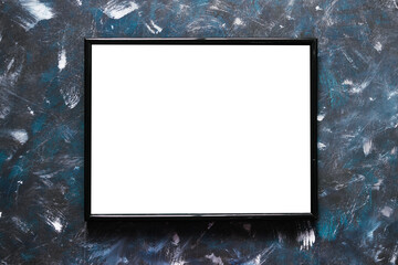 black rectangular picture frame mock-up with copy space for yout text or image on top of hand painted navy blue background