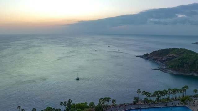 aerial hyperlapse view sunset at Laem Promthep Cape..Promthep cape viewpoint is the most popular viewpoint in Phuket island..time lapse day to night 4K video of Majestic sunset landscape.