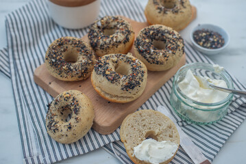 home made whople grain Bagels with cheese on a table