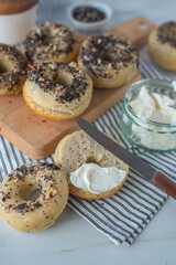home made whople grain Bagels with cheese on a table