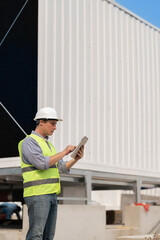 Industry engineer under checking the industry cooling tower air conditioner is water cooling tower...