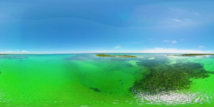 A tropical island with palm trees and a beach. Philippines. Tandoyong Island. 360VR.