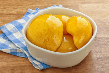 Sweet canned peaches with syrope