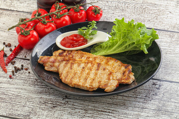 Grilled pork steak with ketchup