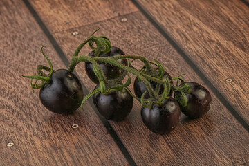 Ripe tasty black cherry tomato