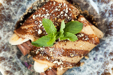 pancakes with chocolate paste and banana
