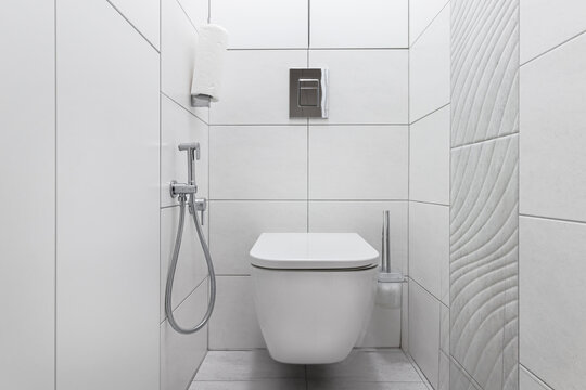 Modern white toilet with toilet and hygienic shower