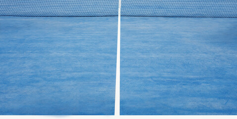 Blue tennis court background with net and hard surface for training and practice. Part of empty...