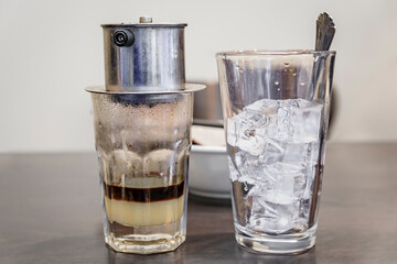 Traditional Vietnamese drip coffee with condensed milk at a coffee shop