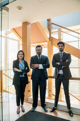 Fototapeta premium Successful indian business people giving expression at modern office.
