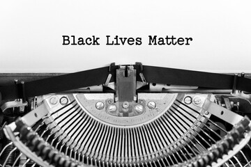 Black Lives Matter phrase closeup being typing and centered on a sheet of paper on old vintage typewriter mechanical