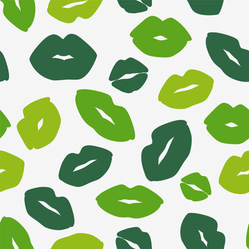 Green lip print on white background. Seamless pattern with kiss. Decorative wallpaper for St Patrick's day holiday design. Vector stock illustration
