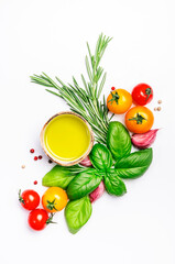 Fresh summer spicy herbs and spices for mediterranean diet. Banner. Tomato, green basil, olive oil, garlic and other. Vegan healthy food on white background. Cooking concept, top view, copy space