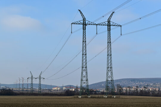 Rural landscape with pylons of 400 kV power transmission lines of the Czech transmission system.