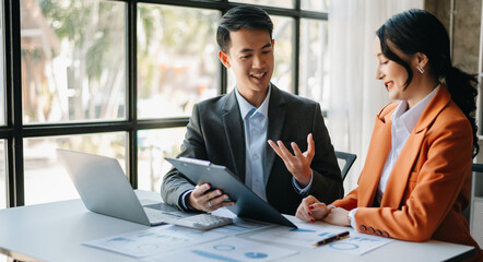 Portrait of success business people working together in office. Couple teamwork startup concept