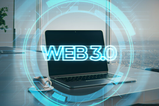 Web 3.0 - a new generation of the Internet, using blockchain and AI, modern technologies IoT. Laptop and coffee cup with hologram on desktop and office with city view background. Double exposure.