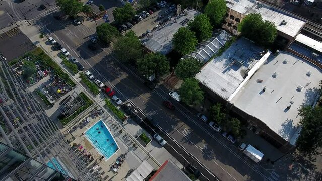 Chicago USA, Aerial View of Wabash Avenue Traffic and People in Swimming Pool on Sunny Summer Day