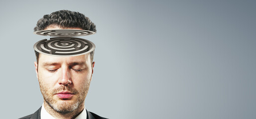 Abstract portrait of maze headed businessman on wide light background with mock up place....