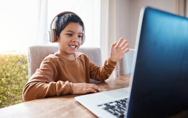 Elearning, wave and kid on laptop video call with headphones for education or studying. Development, growth and happy boy waving on computer for greeting in virtual or online class for homeschool.