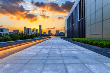 Fototapeta premium Empty square floor and city skyline with modern buildings at sunset in Ningbo, Zhejiang Province, China.