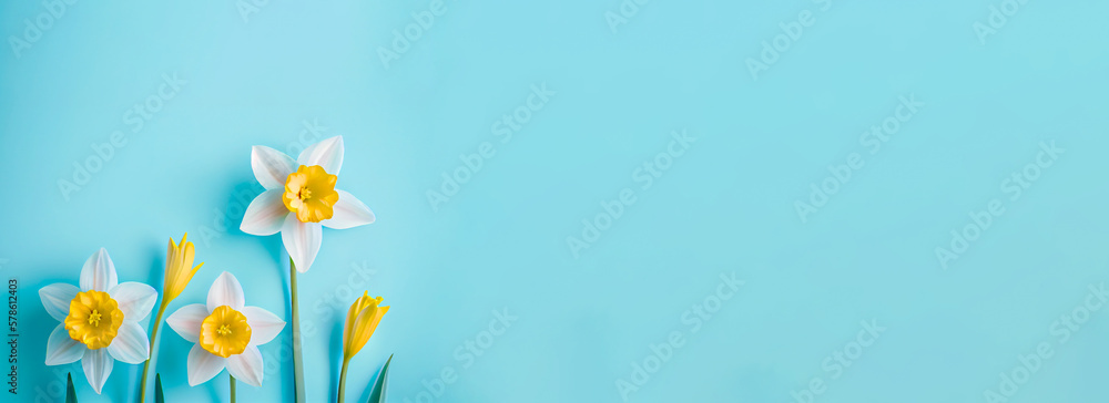 Poster spring easter background with top view of daffodils bouquet on light blue background with copy space