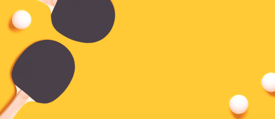Banner with tennis rackets and white balls on a yellow background. Ping pong concept.