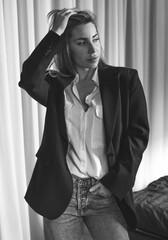 Naklejka premium Stylish woman in suit, women's beauty concept, modern unisex fashionable look