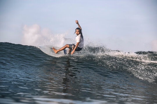 Carefree man surfing on sea