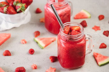 Closeup of red berry fruit smoothie with fresh fruit