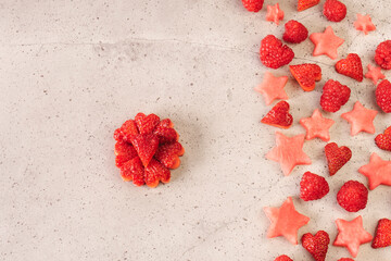 Overhead view of fresh red berries arranged on counter top