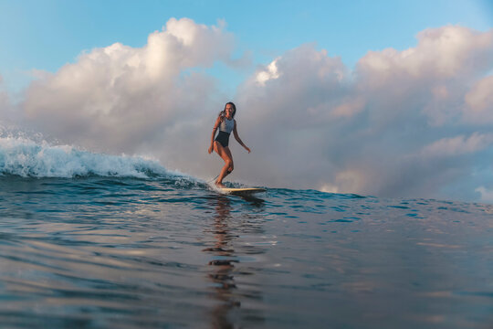 Female surfer on a wave