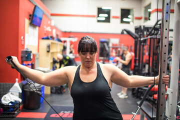 Woman using resistance bands at the gym