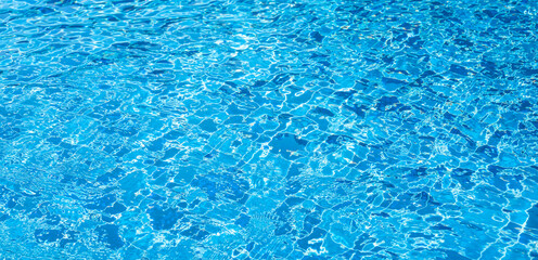 Fototapeta na wymiar summer background, swimming pool bottom ripple and flow with waves background. blue sea water, texture of water surface..