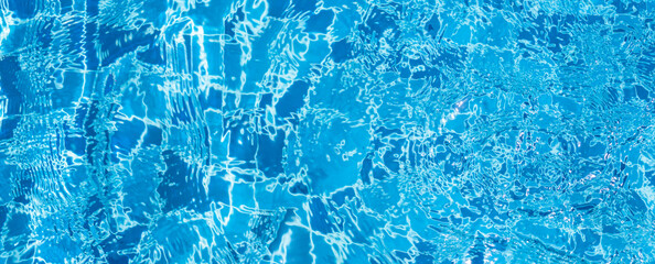 summer background, swimming pool bottom ripple and flow with waves background. blue sea water,...