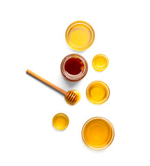 Honey and walnuts on a white background top view