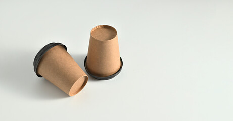 paper cups for coffee, disposable container for drinks on a white background, banner, place for text