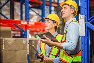Workers working in warehouse, Manager and supervisor taking inventory in warehouse, Female foreperson making plans with warehousemen