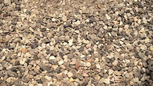 Temanggung, Indonesia - September 2022 : video of gray stone chips, perfect for presentation video background, education, presentation, dokumentation, ect
