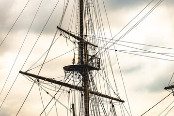 Fototapeta premium Image composed of a set of ropes and pulleys on an old 3 masts, on a white background. 