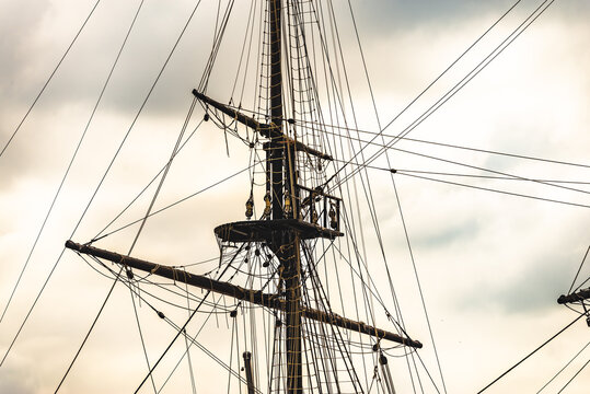 Image composed of a set of ropes and pulleys on an old 3 masts, on a white background. 