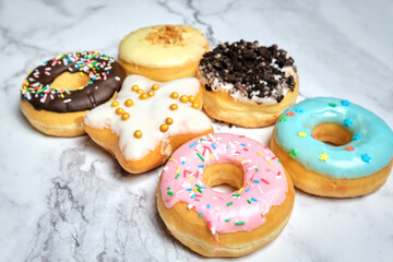 several different donuts on a white background