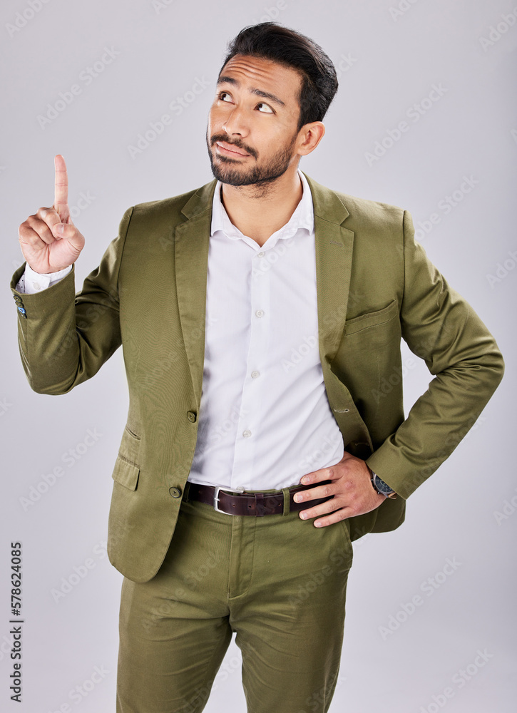 Poster Pointing, solution and idea with man in studio for thinking, product placement and direction. Isolated, confident and question with guy and gesture for development, alert and show in gray background