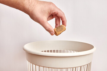 The wine cork is thrown into the trash. Waste disposal and recycling.