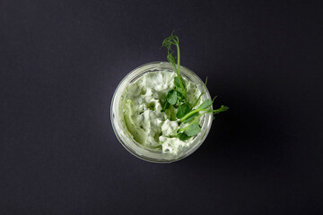 A sprig of peas in sour cream