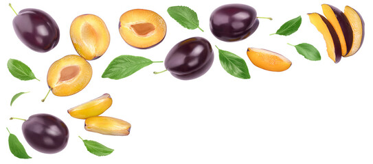 fresh purple plum and half with leaves isolated on white background with copy spase for your text. Top view. Flat lay