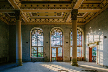 Large hall with columns in old abandoned mansion. Tskaltubo, Georgia