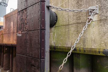 Concrete berth of the seaport with a fender to protect the ship's hull.